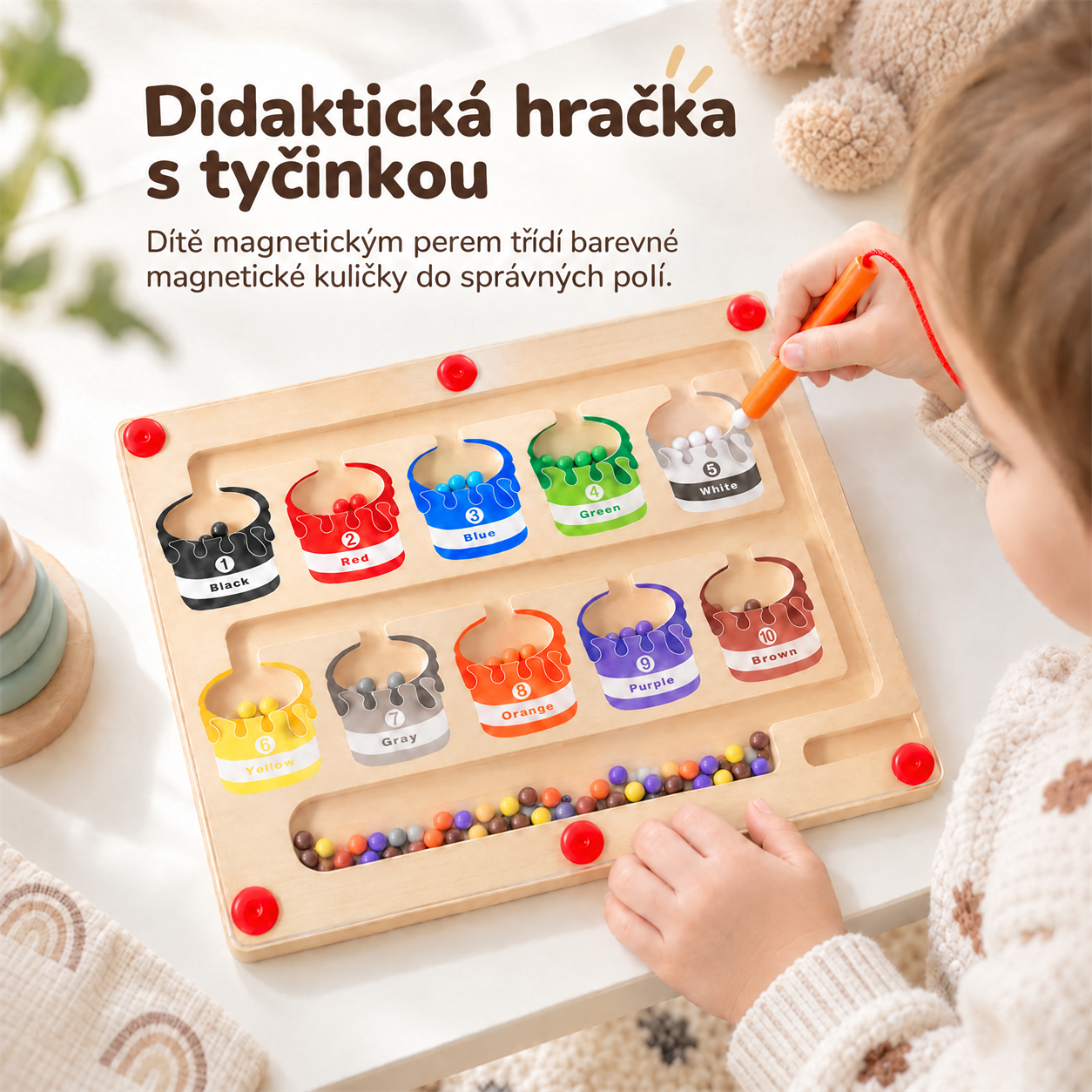 Ova didaktička igračka ima štapić koje dijete koristi kako bi sortiralo obojane magnetske loptice u odgovarajuće kutije!
